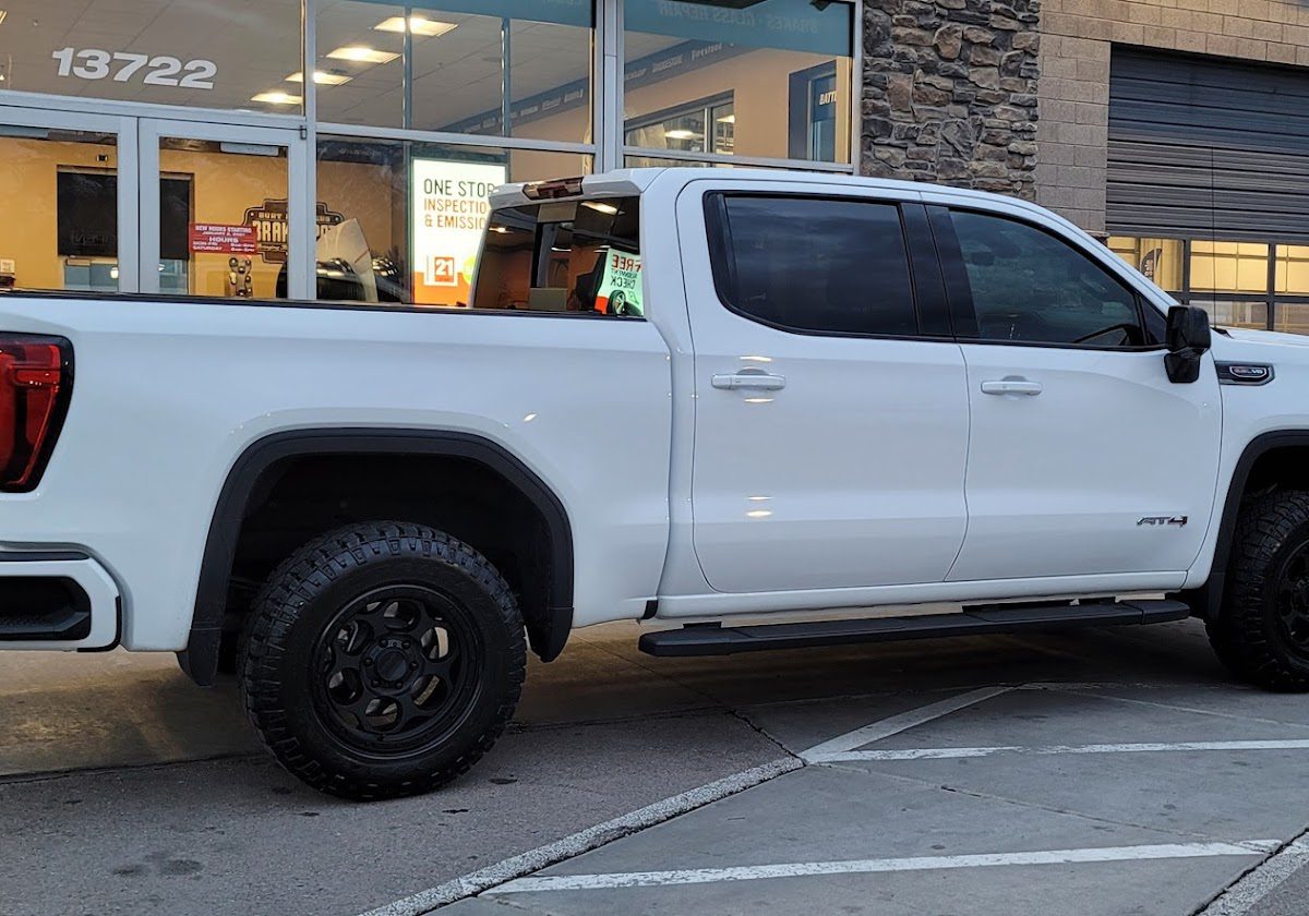 Right side view of a white, four door, 2022 GMC Sierra