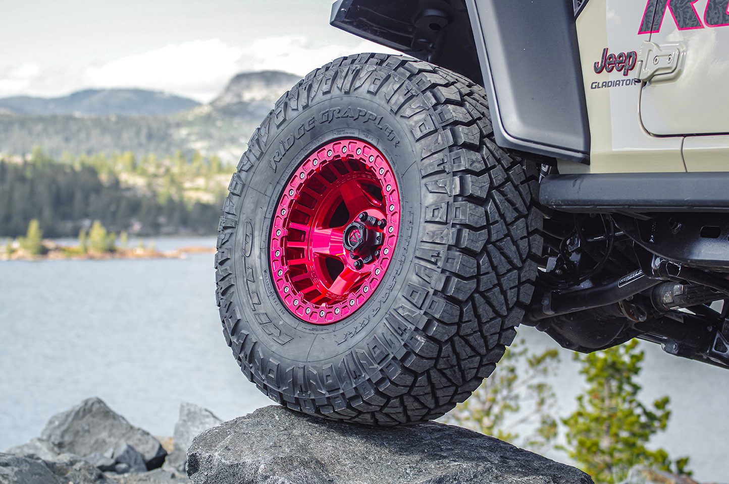Jeep Gladiator with custom red wheels