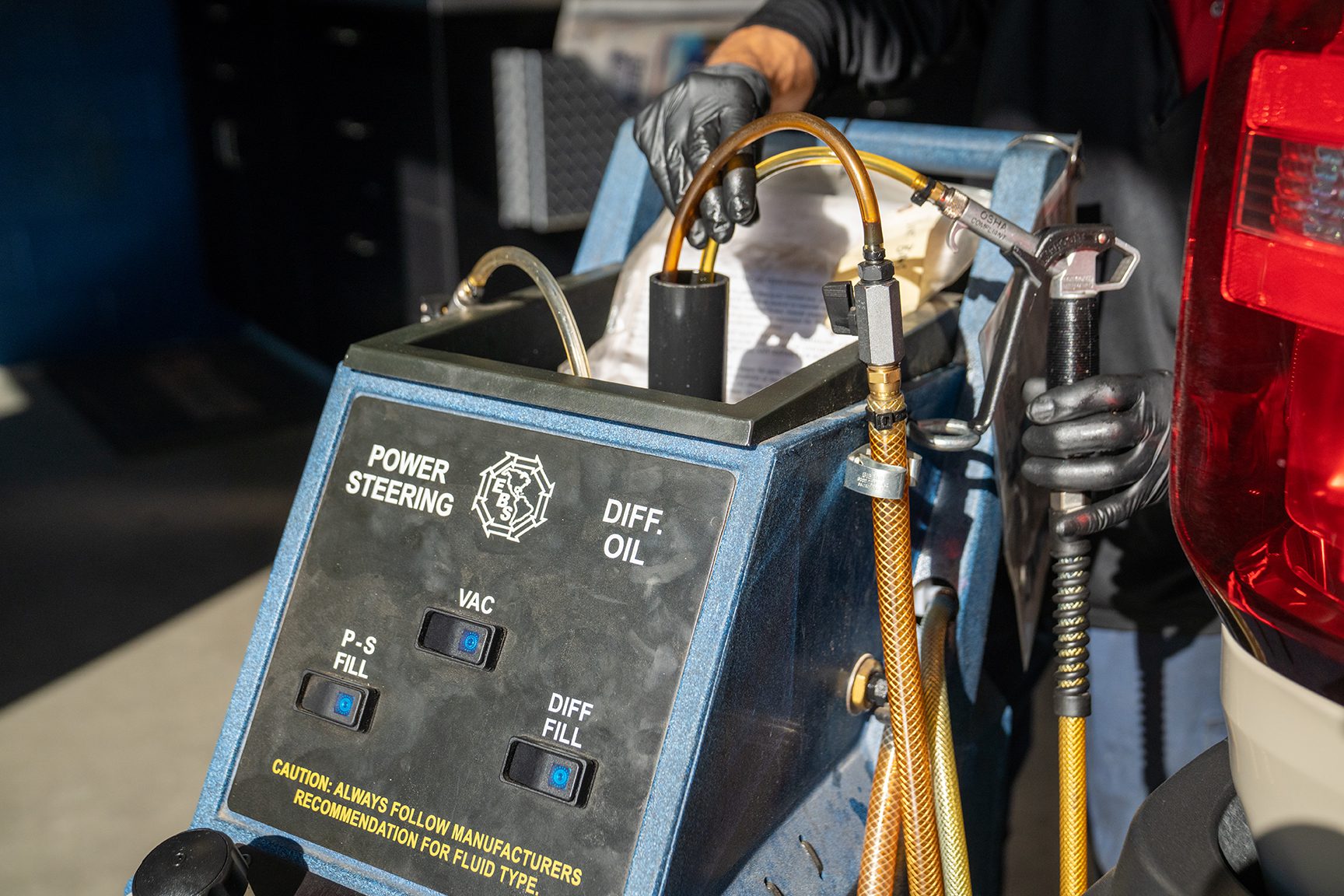 Burt Brothers technician performing a differential power flush service.
