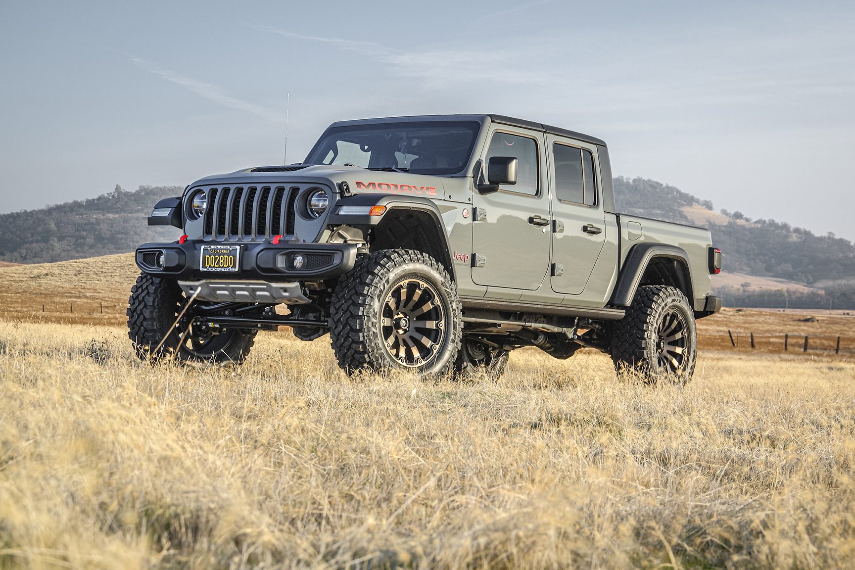 2023 Jeep Gladiator Mojave with a 4″ lift and 37″ Wrangler Duratrac Tires with Metal wheels