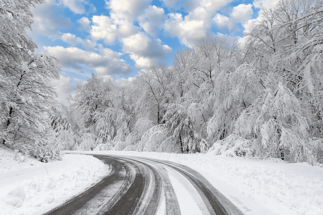 Inside view of a car driving on a snow covered road